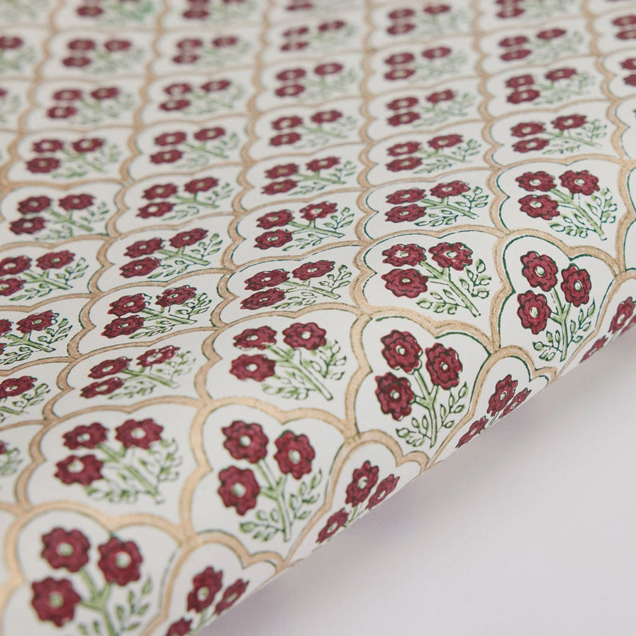 Floral patterned fabric with red flowers on a white background