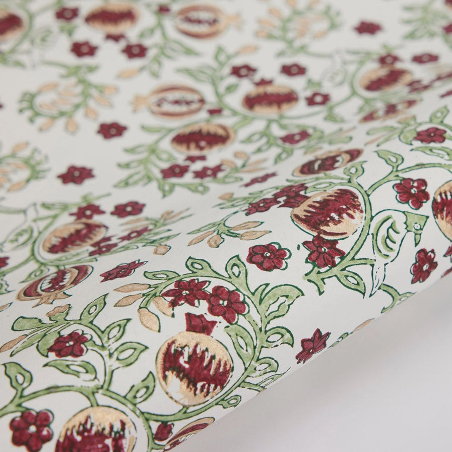 Floral fabric with pomegranate pattern on a white background