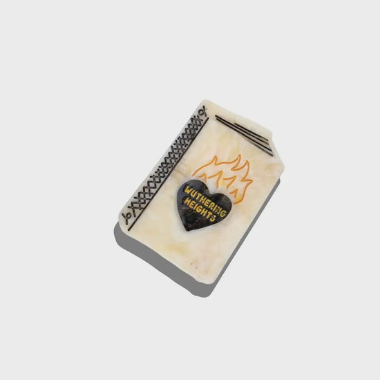 hair clip in the shape of a book with wuthering heights written on it