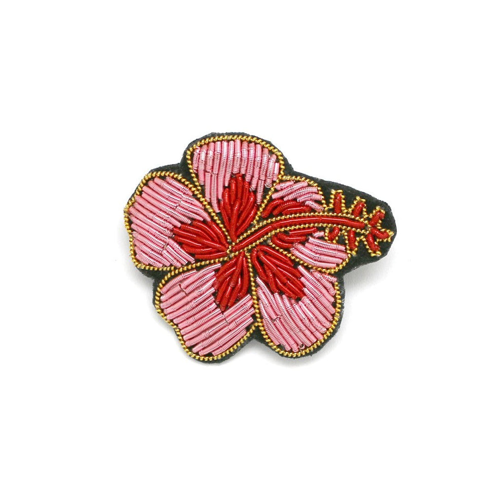Embroidered flower brooch with pink petals and red center on a white background, featuring mooncc and Habaha logos.